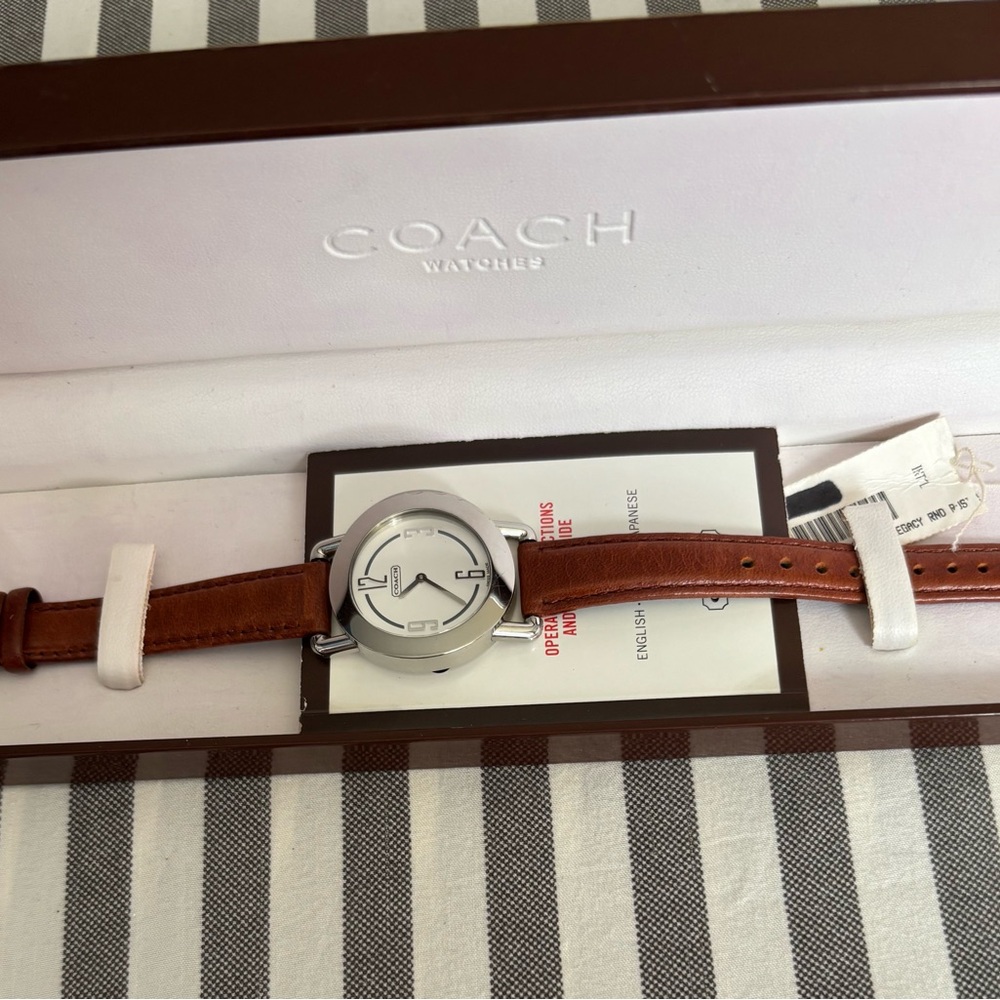 Vintage New Coach Tan Leather Strap Watch with Silver Case.